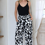 Model wearing Jaxie Pants in Black from Salty Crush