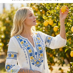 Dams retro artistisk svensk midsommarblommig topp med V-ringning