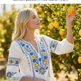 Dams retro artistisk svensk midsommarblommig topp med V-ringning